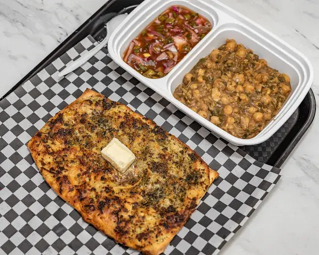 Indian fusion dishes at Pizzaa Doctors in St. James, Winnipeg